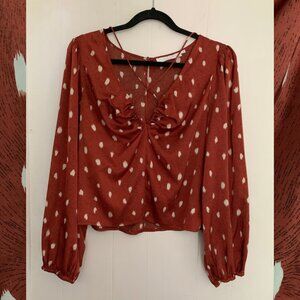 ASTR The Label rust balloon sleeve blouse with white polka dots size L